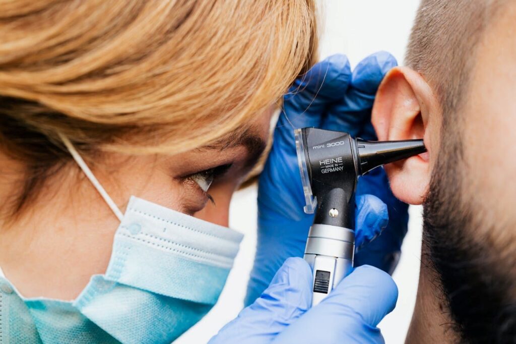 doctor examining a patient's ear