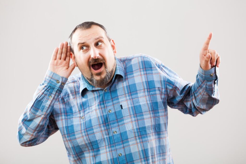 man having trouble with hearing