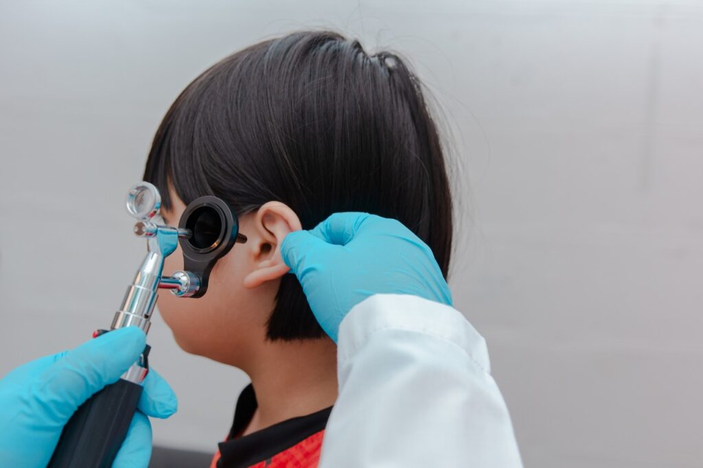 young child getting his ear checked
