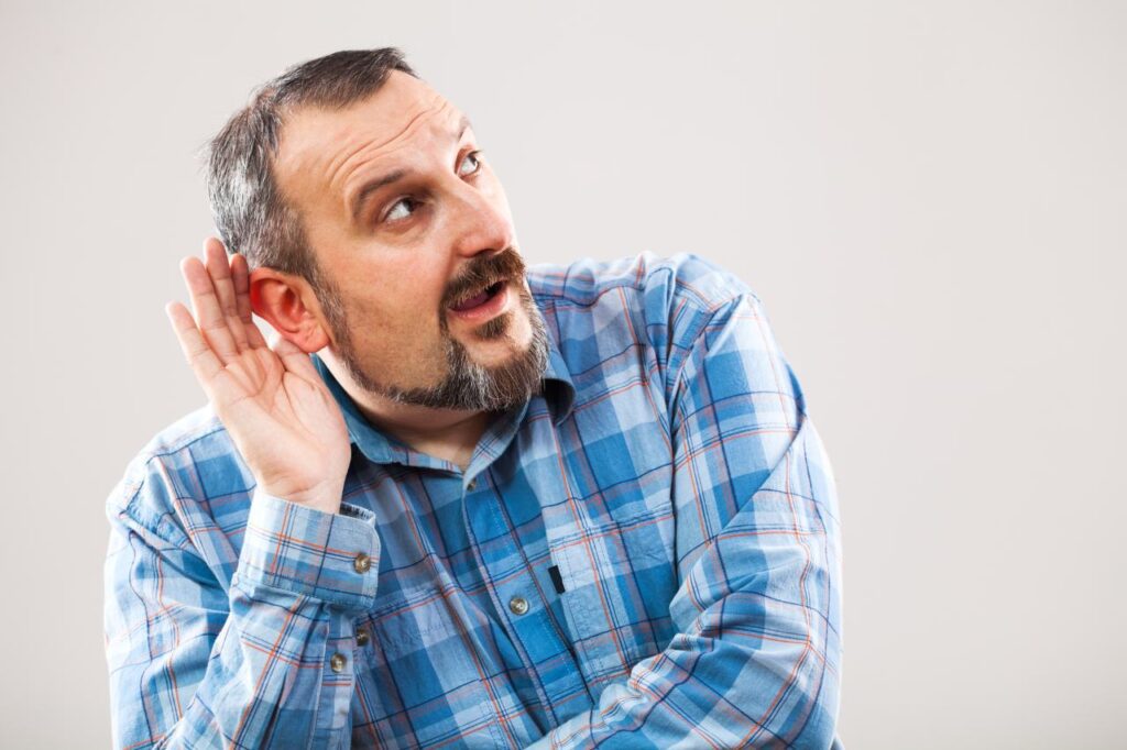 man having problems with his hearing