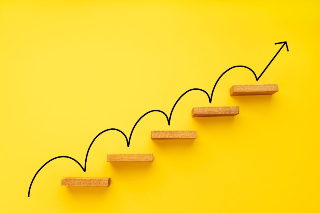 yellow stairs on yelow background depicting different stages