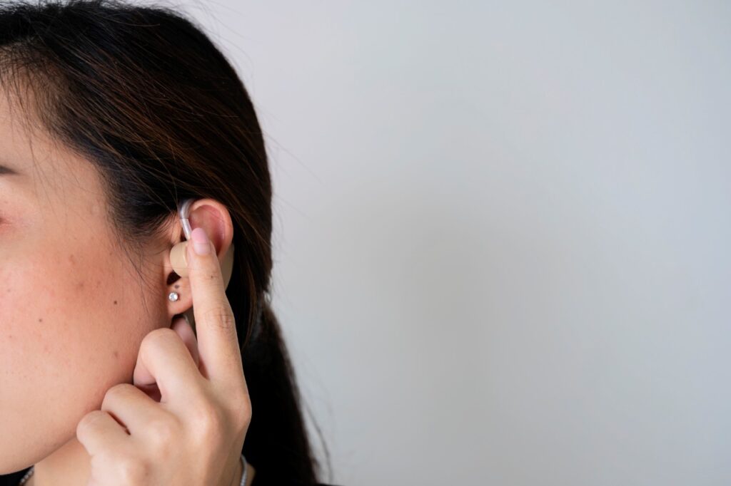 woman wearing a hearing aid