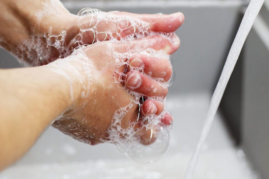 hands with soap bubbles