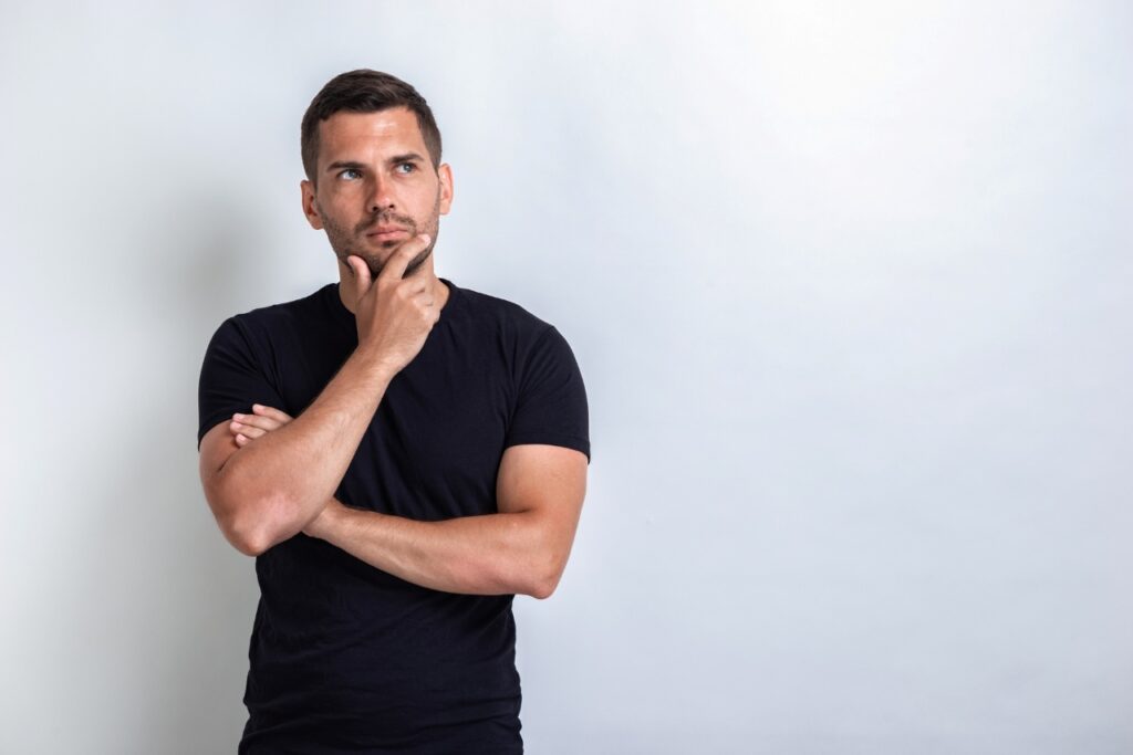 thinking man wearing a black shirt