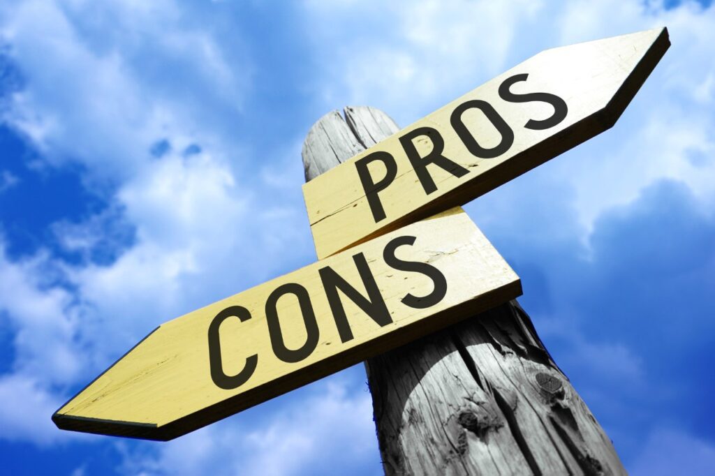 words pros and cons painted on wooden arrow sign post
