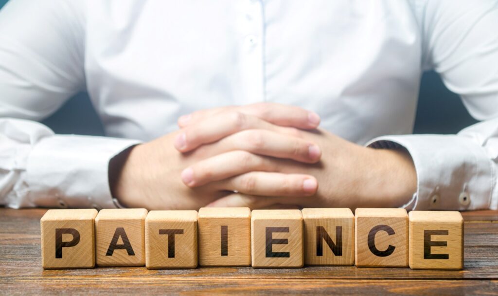 word patience spelled on small wooden blocks