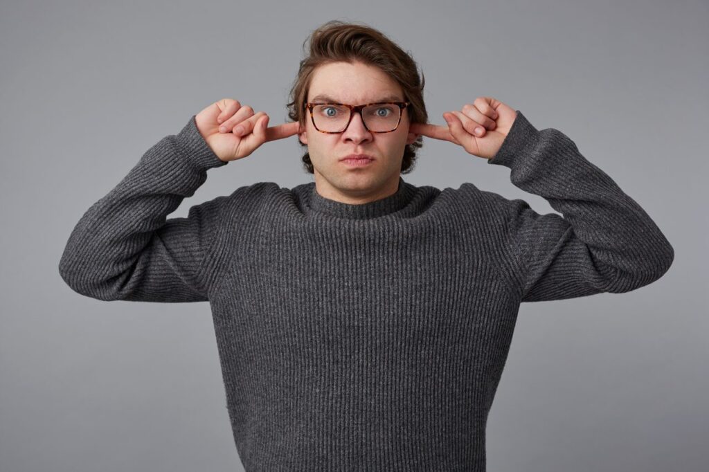 man having trouble with hearing