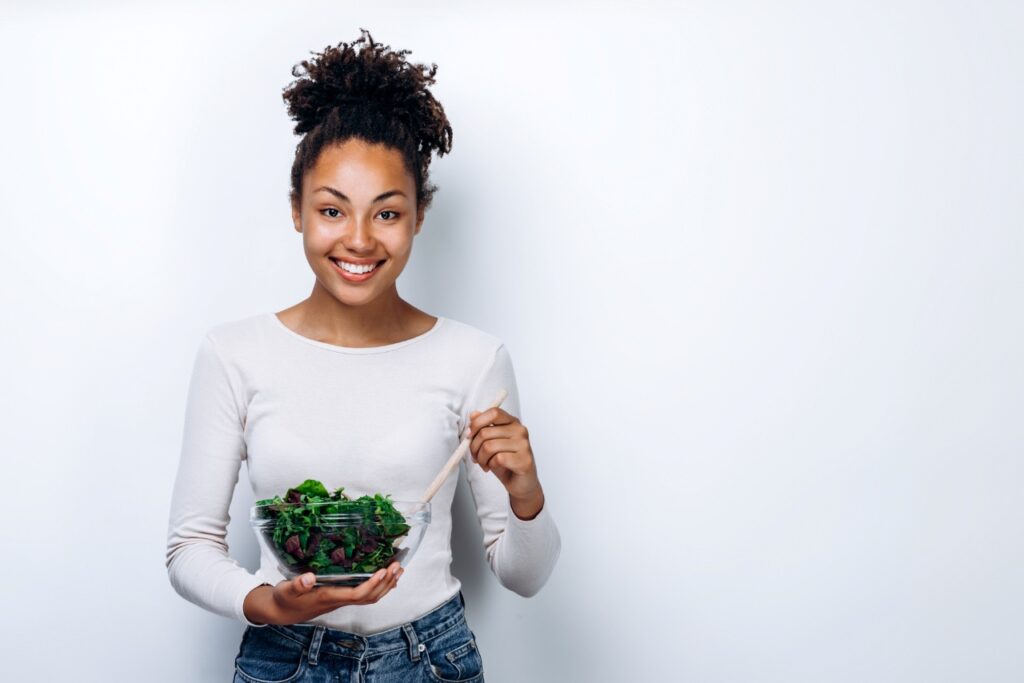 beautiful woman eating a salad