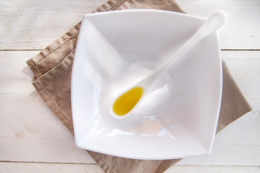 Small containers with extra virgin olive oil