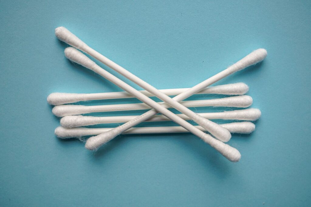 cotton swabs on blue background